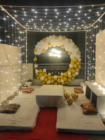 A wide shot of the fairy light cabana on a terrace, creating a perfect ambiance for a night party.