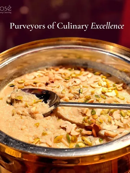 A close-up of a creamy Indian dessert, possibly kheer or phirni, garnished with nuts. As purveyors of culinary excellence, we offer an unmatched combination of sophistication and delectable flavors.