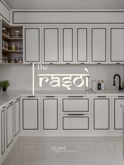 This is 'The Rasoi', a kitchen I designed to be the true heart of the home. The clean lines, monochrome palette with bold black borders, and smart storage solutions make it both highly functional and beautifully inspiring for everyday cooking and family moments.