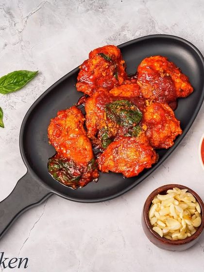 A simple yet flavourful Thai Chicken starter. The chicken is cooked in a spicy red sauce with basil, offering an authentic taste of Thai cuisine.