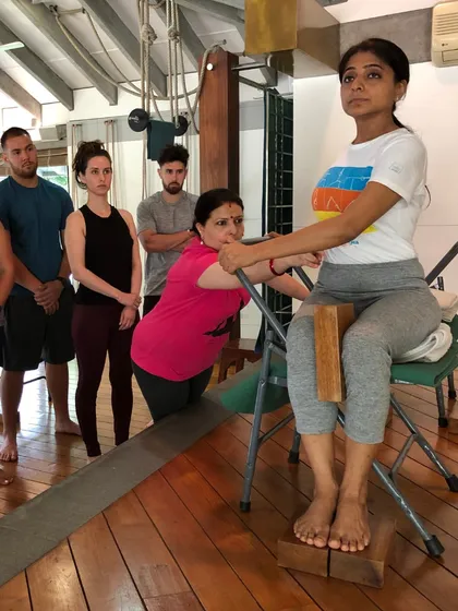 This collection of images captures the essence of my classes. You will see students of all levels using various props, receiving individual adjustments, and practicing together with focus and dedication. Each photo is a glimpse into our journey of alignment and discovery.