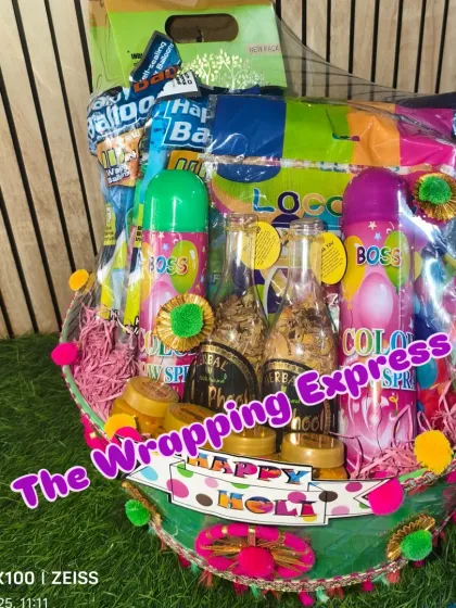 Getting into the festive spirit with a colorful Holi hamper. This basket is packed with everything needed for a fun celebration, including organic gulal, water balloons, pichkaris, and traditional sweets.