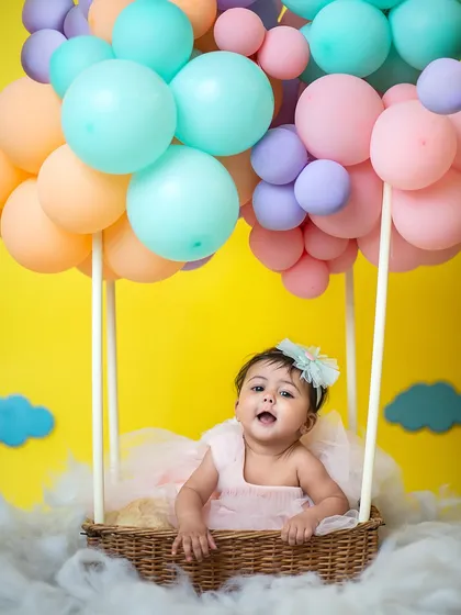 Reaching out with excitement! This interactive shot shows just how much fun babies have in our themed setups.
