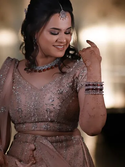 A candid shot of Dr. Krishnaveni at her reception. Her natural, skin-like makeup finish looks effortlessly elegant.
