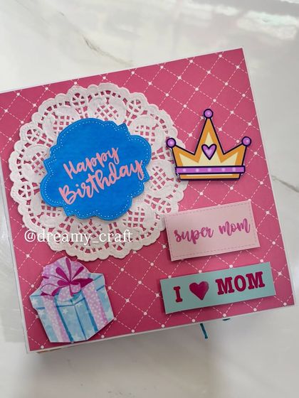 The cover of a memory album I made for a mom's birthday, with "Super Mom" and "I love Mom" stickers.