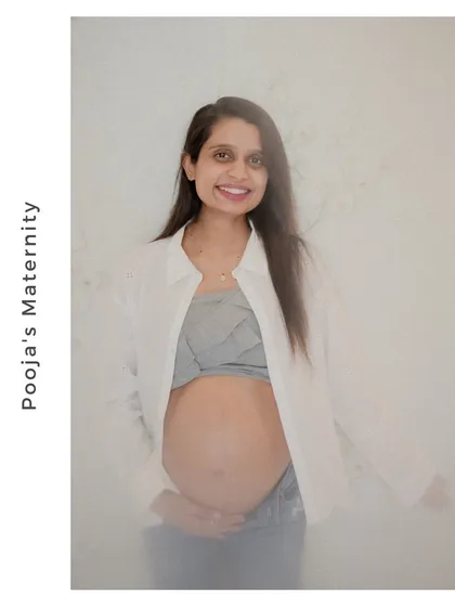 A classic solo maternity portrait. The soft lighting and direct gaze create a powerful and confident image celebrating the mother's journey.
