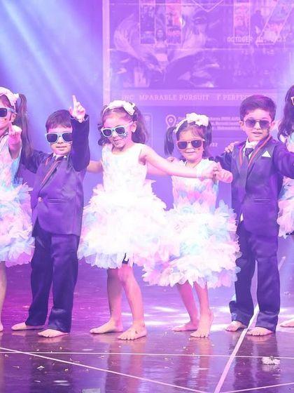 Cool shades and cooler moves. Our youngest performers, aged 4-9, bring incredible style and attitude to the stage in their dazzling costumes for the annual show.