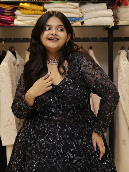 This navy blue Indo-Western gown combines tradition with a modern, bold silhouette. It's a perfect example of how I make glamour feel effortless and accessible.