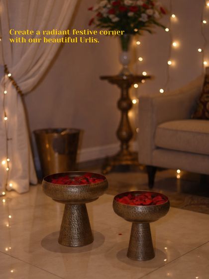 Create a radiant festive corner in your wedding home with our beautiful urlis. This pair of hammered brass urlis on stands can be filled with water and rose petals for a classic and welcoming decor element.