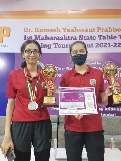 Another shot of our U-21 finalists, Vidhi and Ananya, with their trophies. Their friendly rivalry pushes both of them to become better players every day.