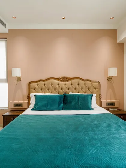 Another view of the bedroom from image 60, showcasing the overall color scheme.