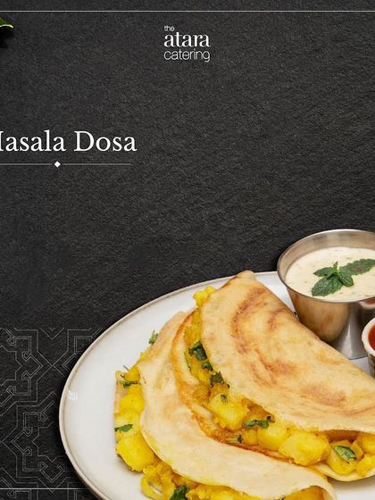 A classic Masala Dosa from our South Indian menu. The crispy crepe is filled with a spiced potato mixture and served with chutney and sambar.
