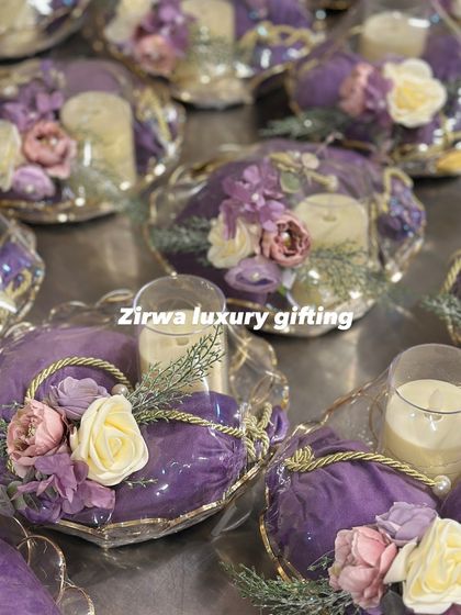 For a client who loved the colour purple, I designed these wedding return favours. Each platter holds a candle and a potli, all wrapped and decorated with purple flowers and golden cords for a cohesive and royal theme.