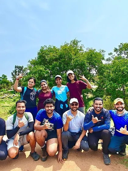 A group of trekkers posing on a sunny day, with a clear blue sky. We have treks for all seasons, each offering a unique experience.