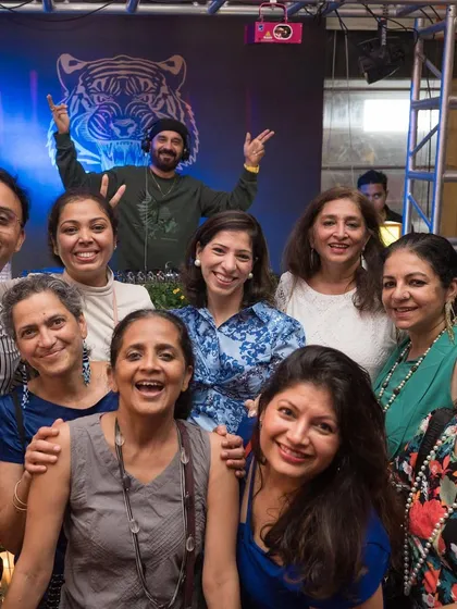 Posing with a group of happy partygoers at Badmaash.