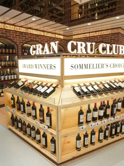 A well-lit shot of the Gran Cru Club's wine selection. We use careful lighting techniques to make products stand out on the shelf, an important aspect of food and beverage photography for retail.