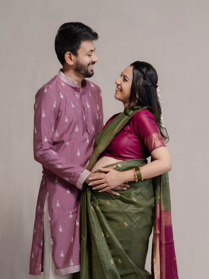 The shared glance between a couple holds so much of their story. For Mehul and Vidhi, this moment in their traditional maternity shoot is full of excitement and love for the future they are building together.