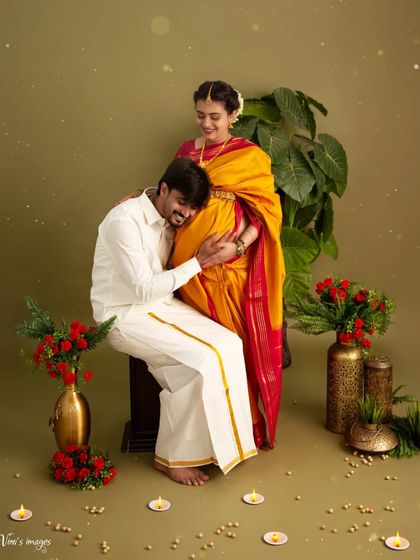 A tender moment as the father-to-be listens to the baby's kicks. This pose beautifully captures the connection and excitement of the couple during their pregnancy journey.