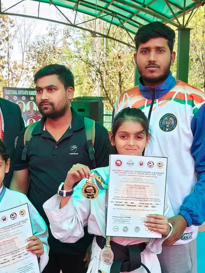 Two of our youngest champions from the sub-junior category proudly showing their gold medals at the Noida Stadium.