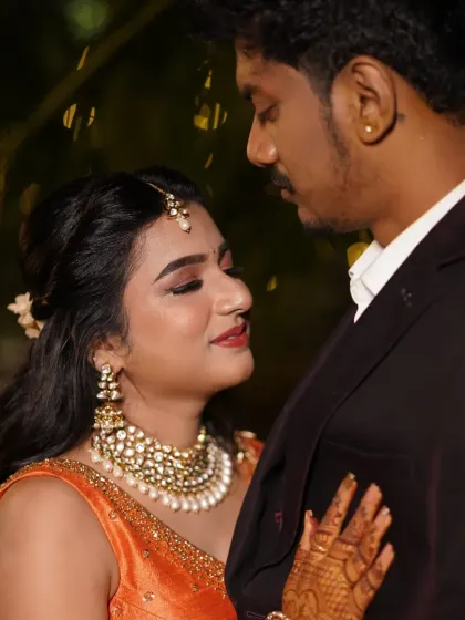 An intimate couple portrait, with the focus on their happy expressions and her flawless makeup.