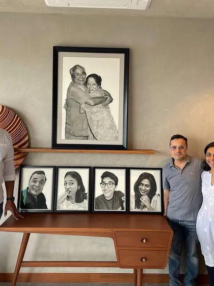 It is always a pleasure to see my art find its home. Here I am with my clients, who commissioned a series of family portraits. Seeing their satisfaction with the final collection is the most rewarding part of my work.