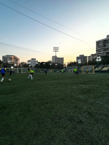 An evening training session in full flow under the floodlights. The vibrant green pitch and active players show there's no better way to spend a Tuesday evening.