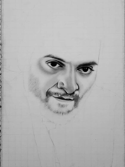 The 90-hour process of creating the Guddu Pandit portrait. These images show the careful layering of charcoal and graphite to achieve the intense, gritty look.