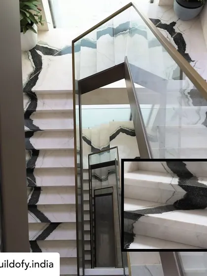 The staircase is often the spine of a home, and I wanted this one to be a dramatic centerpiece. We used bookmatched Panda marble, meticulously ensuring the natural veins flow seamlessly from the ground floor to the top. It’s a bold architectural statement that showcases the beauty of natural stone.