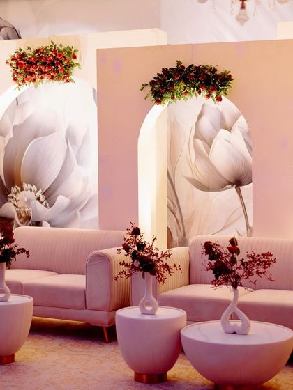 Another view of the modern lounge seating, showcasing the clean lines and the sophisticated color palette of pink, white, and red.
