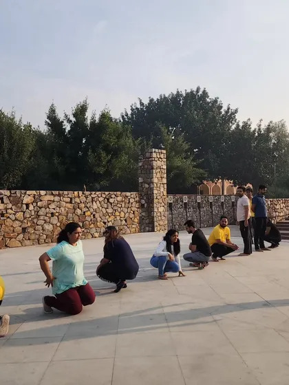 A moment of fun and games during our yogic picnic. It's all about connection, laughter, and enjoying the day together as a community.
