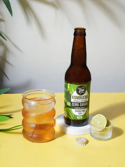 A bright and sunny product shot for Toyo Kombucha. The yellow background and fresh lime create a healthy and refreshing vibe for this zero sugar sparkling tea.