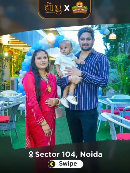 A young family poses for a photo in our decorated outdoor dining area during a birthday party.