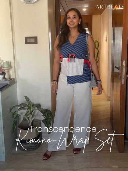 Here I am wearing the Transcendence Kimono-Wrap Set at home. The indigo stripes and art-detailed pockets create a modern ode to the classic kimono, perfect for versatile styling.