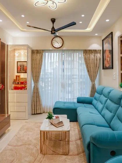 Another angle of this luxurious living room, highlighting the breakfast counter that connects to the kitchen and provides additional seating.