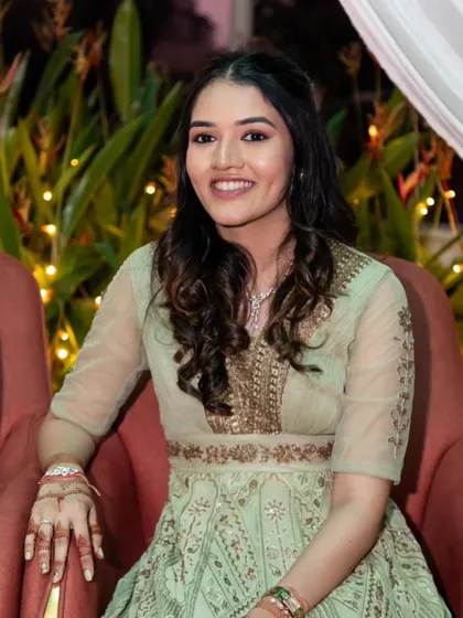 A simple yet stunning look for an engagement ceremony. The bride's hair is styled in natural-looking waves, and her makeup is fresh and minimal to let her happiness shine through.