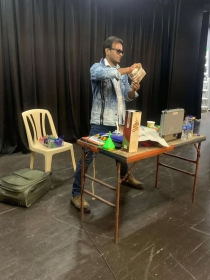 A behind the scenes look as I prepare my props on stage before a show. Every illusion, from card tricks to larger acts, is carefully set up to ensure a smooth and magical performance.