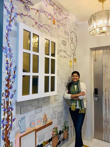 Art can transform a house into a home. For this residential entryway, I painted a French-themed mural with delicate floral branches to create a warm and elegant welcome, seamlessly blending with the home's interior design.