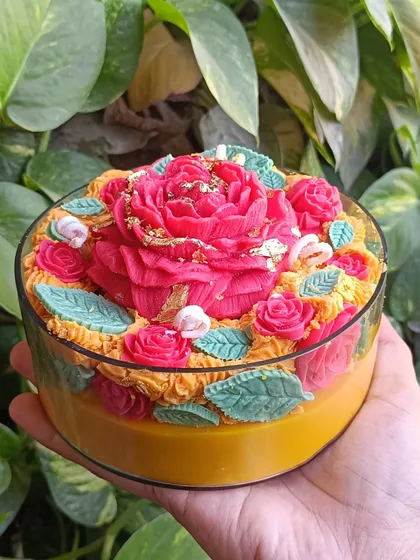 An overhead view of the rose garden jar candle.