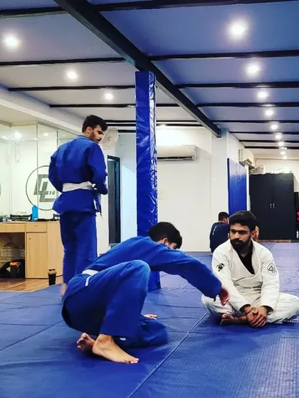Time on the mats is the only thing that counts. Here, students practice techniques in the Gi, learning to use grips to control and submit their training partners.