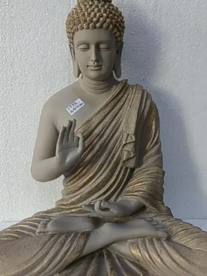 A full view of a meditating Buddha statue in a classic beige and gold finish. This is one of my most popular designs, perfect for creating a calm corner in your home or garden.