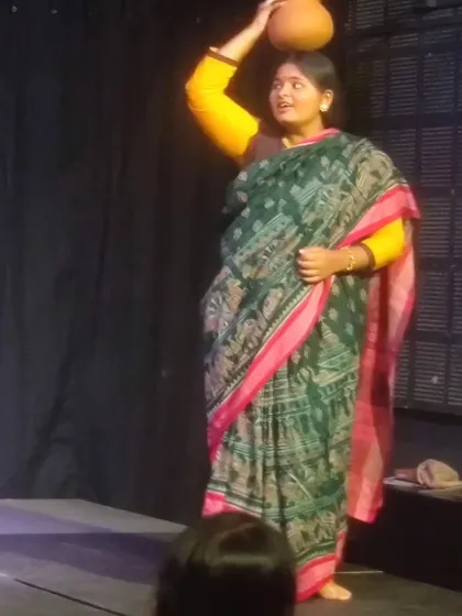 A young actress delivering her lines with confidence and grace during a performance at Vyoma.