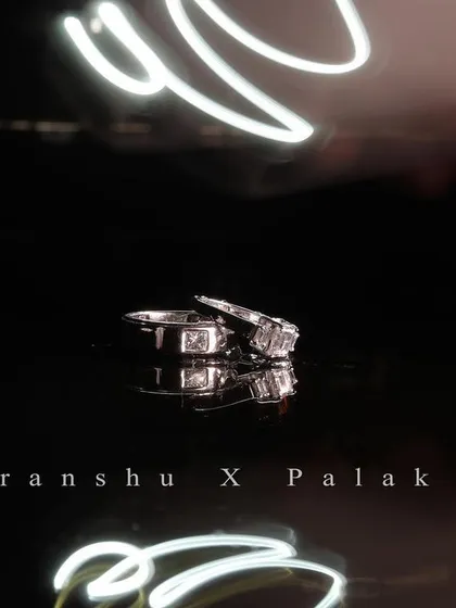 The details matter. For this ring shot, I used a slow shutter speed and light painting technique to create a unique and creative photo that highlights the symbol of the couple's commitment during their ring ceremony.
