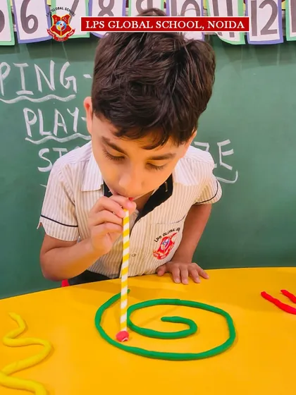 Another student tackles the spiral maze, demonstrating the fine motor control and breath regulation this simple yet effective activity teaches.