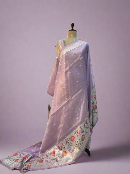 Another angle of the lilac tissue saree with a Paithani border, showing the smooth texture of the fabric.