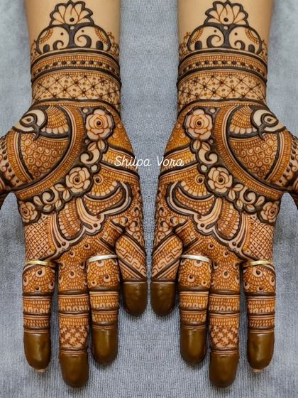 A beautiful Rajasthani design featuring peacocks and roses, with delicate line work and shading that creates a sense of depth.