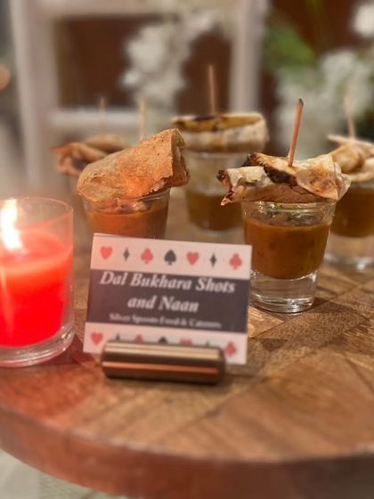 A modern take on a classic Indian dish: Dal Bukhara Shots served with miniature naan. This innovative presentation is perfect for parties, allowing guests to easily mingle while enjoying a taste of tradition.