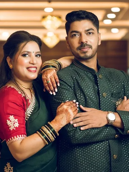 A confident and stylish pose from the couple in an elegant indoor setting, perfect for their engagement album.