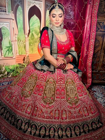 A full-length shot of the bride, looking like royalty. The heavy lehenga is balanced with elegant makeup and hair.