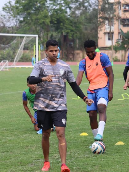 Working with a player on his footwork. The small details often make the biggest difference in performance.