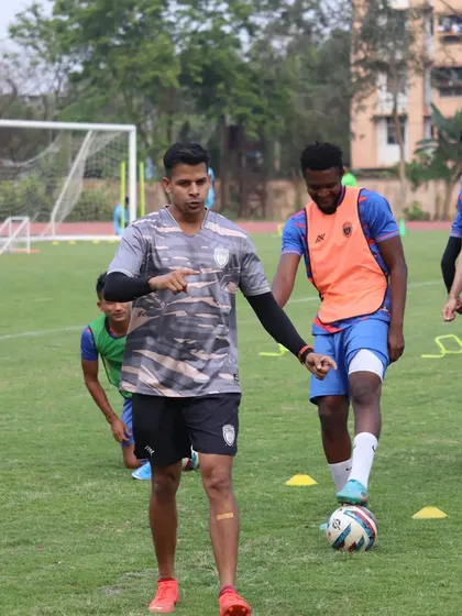 Working with a player on his footwork. The small details often make the biggest difference in performance.
